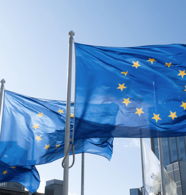 European Union flags waving in front of a building