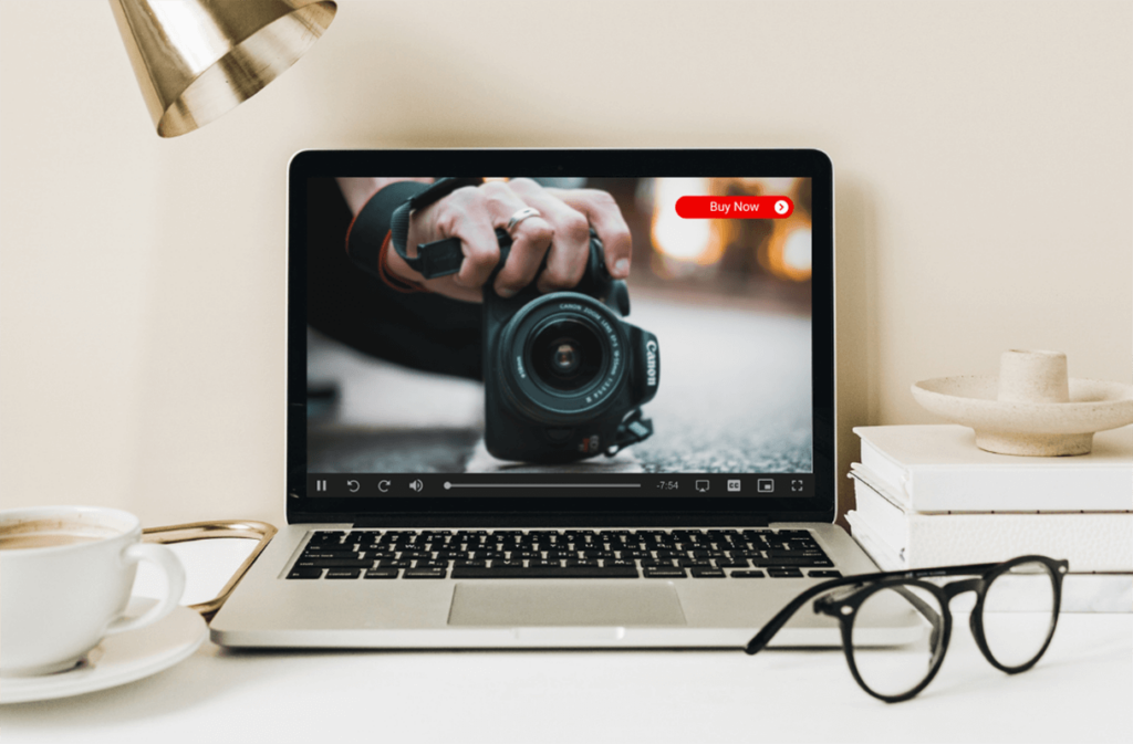 Laptop playing a video with a buy button, boosting conversion with video