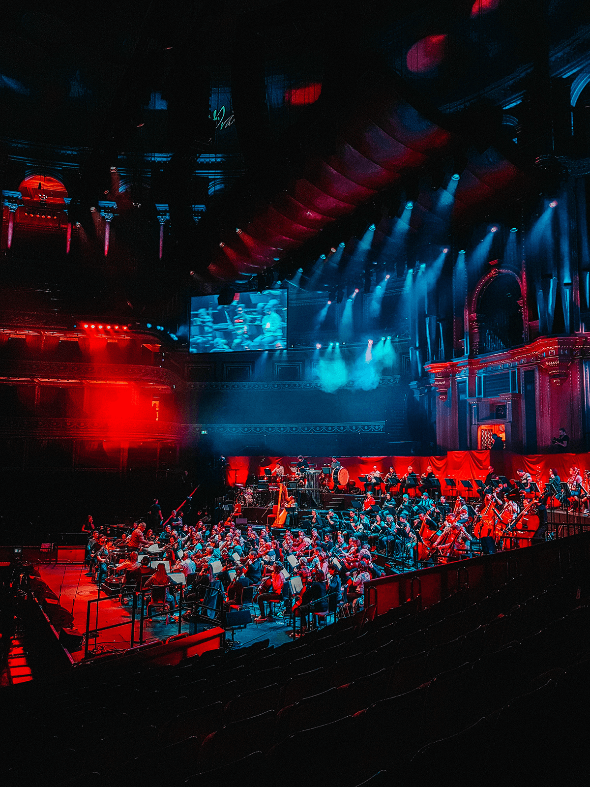 Orchestra concert hall with red and blue lighting, illustrating event streaming