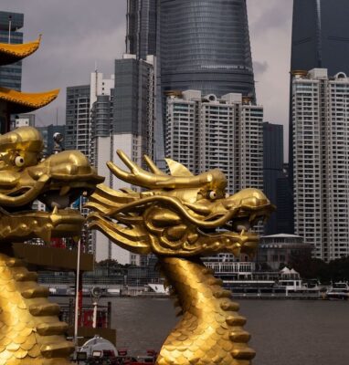 Golden dragon sculpture before the Shanghai skyline, live streaming events to China