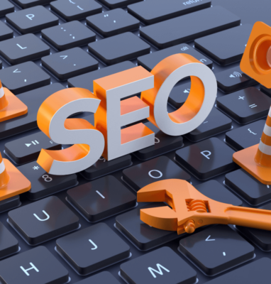 Orange SEO letters and tools on a keyboard, cover for improving video SEO