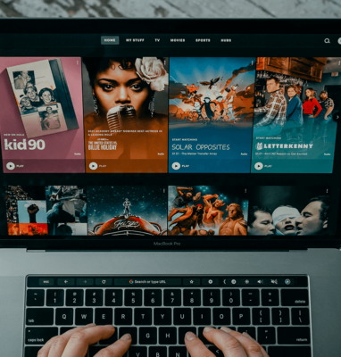Laptop showing an OTT streaming platform with video catalogue